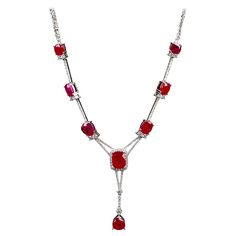 An entry level Ruby and Diamond Necklace in 18K White Gold. This is the prefect entry level ruby Necklace as it is not too grand but at the same time it is well designed and looks expensive. You have 3 smaller ruby on one side of the necklace and a bigger one at the middle. On top of that, dripping of the smaller ruby away from the main stone making the whole necklace longer and differentiate it from a choker to a full length Necklace. If you are interested in this entry level full length necklace design please feel free to send us a message to discuss further. The necklace consist of a total of 9 pieces unheated Intense Red Ruby Total Ruby weighs 13.76 ct Total Natural diamond weight is 1.674 ct , The Colour of the Diamond is Approximately E/F with VS Clarity Ruby Diamond Necklace, Ruby And Diamond Necklace, White Diamond Necklace, Velvet Choker Necklaces, Diamond Tennis Necklace, Modern Bracelets, Pearl And Diamond Earrings, Ruby Necklace, White Gold Necklaces