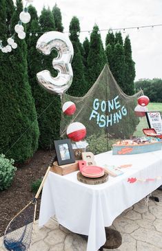 a table with some balloons and other items on it