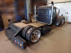 a large semi truck parked in a garage