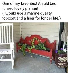 a red bench sitting on top of a porch next to a white chair and potted plants