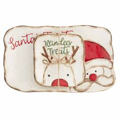 a santa and reindeer plate sitting next to each other