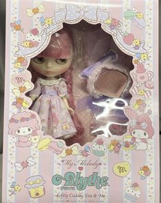 the doll is in its box and it's pink