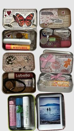 several tins with various items in them on a white surface, one is open and the other has an image of a butterfly