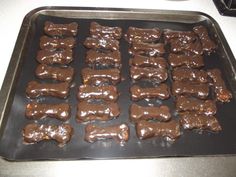 chocolate dog treats on a cookie sheet ready to be baked