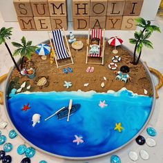 a beach scene made out of sand with chairs, umbrellas and other items on it