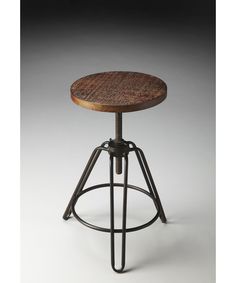 an adjustable stool with wooden seat and metal frame