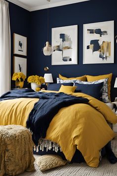 a bedroom with blue walls and yellow bedding in the corner, two pictures on the wall