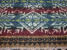 an old rug with many different colors and patterns