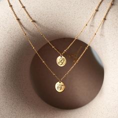 The perfect personalized gift for anyone with a calligraphy initial necklace. It's perfect as a birthday, friendship, mother's day and bridesmaids gift. Features a small round disc on a beaded chain from our signature O Collection. Disc diameter 9mm Adjustable chain: 17-19in (43-48cm) Laser Engraving Gold Vermeil Italian Bead Chain Spring clasp closure Hypoallergenic, lead and nickel free #258G Mother's Day Round Disc Necklaces, Minimalist Round Disc Initial Necklace For Gift, Minimalist Round Disc Initial Necklace As Gift, Elegant Round Disc Charm Necklaces For Gifts, Elegant Round Disc Charm Necklace For Mother's Day, Elegant Round Disc Charm Necklace As Gift, Personalized Pendant Coin Necklace, Elegant Personalized Circle Necklaces, Adjustable Round Coin Necklace As Gift