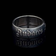 This phrase is a Latin proverb which means "Fortune favors the bold". Sometimes it is also spelled in other ways, e.g. "Audentis Fortuna Iuvat" or "Fortes Fortuna Adiuvat". I can make this font ring with any phrase you want! Just contact me for information and price. You can find a lot of Latin phrases rings on my workshop page. I can implement your any idea - just send us a letter describing your wishes via contact form. Latin ring phrase can also be made in 585 gold. IF YOU NEED "SOLD OUT" SIZE OR MATERIAL OR NEED MORE THAN 1 JUST CONTACT ME! PRODUCTION TIME IS 1-2 WEEKS! Symbolic Adjustable Engraved Ring With Hallmark, Symbolic Adjustable Engraved Hallmarked Ring, Adjustable Engraved Text Ring, Adjustable Ring With Engraved Text For Promise, Adjustable Rings With Engraved Text, Silver Symbolic Jewelry With Engraved Text, Audentis Fortuna Iuvat, Latin Language, Fortune Favors The Bold