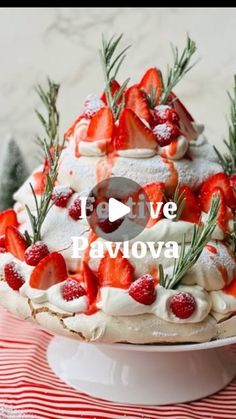 a cake decorated with strawberries and pine branches