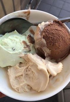 a bowl filled with ice cream and chocolate