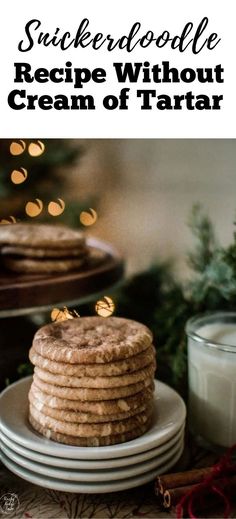 a stack of cookies sitting on top of a plate next to a glass of milk