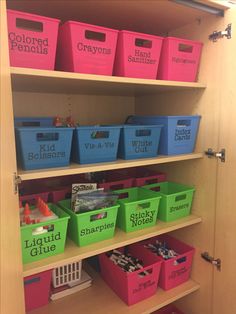 the shelves are filled with different colored bins