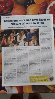 a newspaper article with people sitting in front of it and lots of fruit on the table