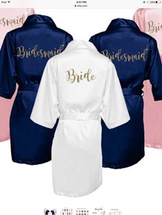 three bridesmaid robes with gold lettering on the front and pink, blue, and white ones