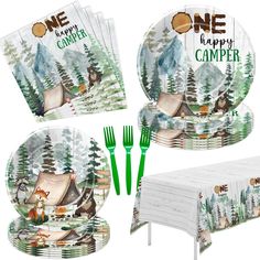 the camper tableware is set with green plastic forks and napkins, along with an image of a tent in the woods