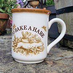 there is a coffee cup that says to bake a hare on the side