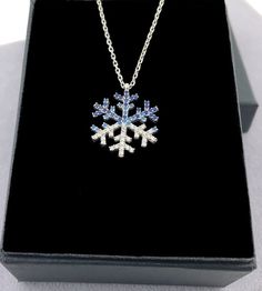 "Dainty CZ Silver Snowflake Necklace, Snowflake Pendant *An exclusive gift jewelry for you and your loved one. This snowflake necklace will be a GREAT choice for you. And they will be an ideal gift for your girlfriend, wife, fiancee, daughter, mother, your special someone in winter, especially for Christmas and Valentines. * Elegant Design: Beautifully aligned Snowflake-shaped with clear zircon sparkly stone * Material: High-Quality Real Solid 925 Sterling Silver (92.5% silver) Nickel-free, Lead Sterling Silver Snowflake Jewelry For Anniversary, Sterling Silver Snowflake Jewelry For Winter, Sterling Silver Jewelry For Winter Gifts, Silver Jewelry As Winter Gift, Sterling Silver Necklaces For Winter Gifts, Silver Jewelry For Winter Gift, Silver Snowflake Necklace For Gift, Sterling Silver Snowflake Jewelry, Blue Snowflake Sterling Silver Necklace