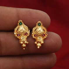 Beautiful yellow gold earrings Gold Purity- 22k yellow Gold Length - 2 cm Width - 1.3 cm Weight - 2.39 grams approx The earrings comes with artificial push If you want real gold push please let us know. Indian Gold Earrings Studs, Fusion Style Gold-plated Jhumkas For Wedding, 22k Gold Jewelry With Matching Earrings For Diwali, Hand Set 22k Gold Bridal Earrings, Fusion Gold Bridal Earrings Hand Set, Heavy Chandbali Earrings For Marriage, Fusion Style Hand Set 22k Gold Earrings, Gold Bollywood Jhumkas For Marriage, Fusion Style Hand-set 22k Gold Earrings