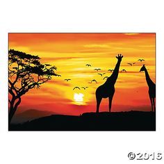 two giraffes are silhouetted against an orange sunset with birds flying in the sky