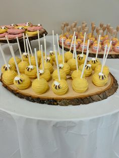 there are many desserts on the table ready to be eaten at this birthday party