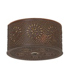 a ceiling light that has an intricate design on the top and bottom, with holes in it