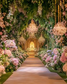 an outdoor ceremony with flowers and chandeliers