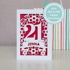 a red and white birthday card with the number twenty on it