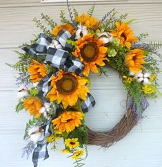 a wreath with sunflowers and cotton balls