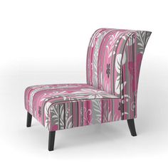 an upholstered chair with pink and grey designs on the back, sitting against a white background