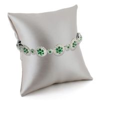 This bracelet features a combination of emerald green nanocrystal and created white sapphires, set in a halo design. The nano emeralds, ranging from 2.0mm to 1.9mm, add a green hue, while the created white sapphires, varying from 0.8mm to 1.1mm, provide contrast. This bracelet is crafted in rhodium over sterling silver, ensuring durability and brilliance. Gold Gemstone Necklace, Cable Bracelets, Halo Design, Lab Created Emerald, Sapphire Gemstone, Sterling Silver Bracelet, White Sapphire, Types Of Rings, Earring Backs