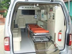 an ambulance with two beds in the back