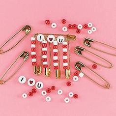 several red and white pins are arranged on a pink surface