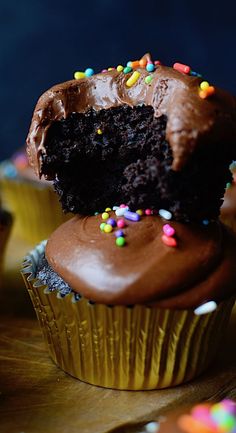 a chocolate cupcake with a bite taken out of it