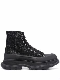 Black lambskin Tread Slick glitter ankle boots from Alexander McQueen featuring glitter detailing, round toe, front lace-up fastening, branded insole, chunky rubber sole and ankle-length. | Alexander McQueen Tread Slick glitter ankle boots Glitter Ankle Boots, Alexander Mcqueen Tread Slick, Designer Ankle Boots, Leather Biker Boots, Glitter Sneakers, Cowboy Style