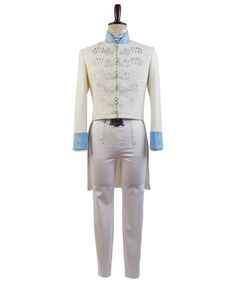 a white suit with blue trimmings and buttons on the chest, standing next to a