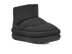 UGG Classic Maxi Mini - Women's Shoes : Black : Stay stylish in soft warm comfort with the UGG Classic Maxi Mini booties. Topically applied water repellency treatment. Textile upper. Rear pull tab construction. Round-toe silhouette. 80% upcycled wool, 20% lyocell lining and insole. Rubber outsole. his product contains real fur from sheep or lamb. Fur may be sourced from Australia, Ireland, the United Kingdom, or the United States. It has been artificially dyed and treated. Imported. Puffer Boots, Ugg Shoes Women, Mini Boots, Ugg Mini, Boots Uk, Black Shoes Women, Ugg Classic, Real Fur, Wash Bags