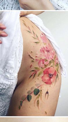 a woman's thigh with flowers painted on it