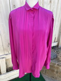 "Vintage 80s dark pink long-sleeve blouse with hidden buttons and puffy sleeves. Size: 12 By: Counterparts 100% Polyester In great vintage condition! Measurements laying flat Armpit to armpit 23\" (46\" total) Top of shoulder to bottom of sleeve cuff 31\" Total length of shirt 28\" Items are shipped out within 1-2 business days. If you have any questions please feel free to message me I reply quickly. Thank you for looking and happy shopping!" Pink Formal Blouse For Fall, Formal Pink Blouse For Fall, Pink Long Sleeve Formal Top, Formal Long Sleeve Pink Tops, Pink Long Sleeve Formal Blouse, Classic Pink Long Sleeve Blouse, Pink Long Sleeve Blouse For Formal Occasions, Classic Long Sleeve Pink Blouse, Vintage Pink Blouse For Formal Occasions