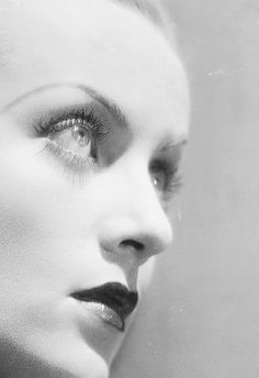 a black and white photo of a woman's face