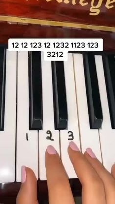 someone is playing the piano with their fingernails and numbers on each key,