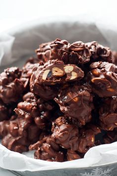 a pile of chocolate almond clusters in a bowl