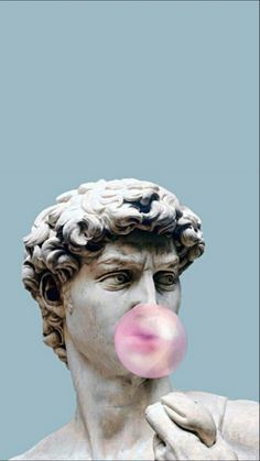 a statue with a pink bubble coming out of it's mouth and the head of a man