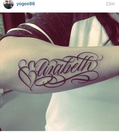 a woman with a tattoo on her arm that says faith and hearts in cursive font