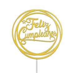 a cake topper that says feliz cumpleares