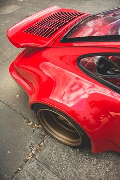 the rear end of a red sports car