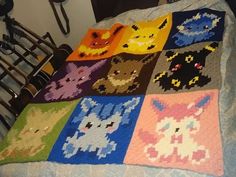 a crocheted blanket that has been made to look like pokemons on it