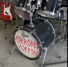 a drum set with the words'coronade goth'written on it in red spray paint