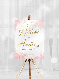 a pink and gold welcome sign on an easel with the words, welcome to america's 5th birthday